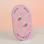 a pill shaped backer card showing blue topaz quartz gemstone clay and 14k gold plated stud earrings set