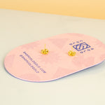 back of pink cold gold earring backer card