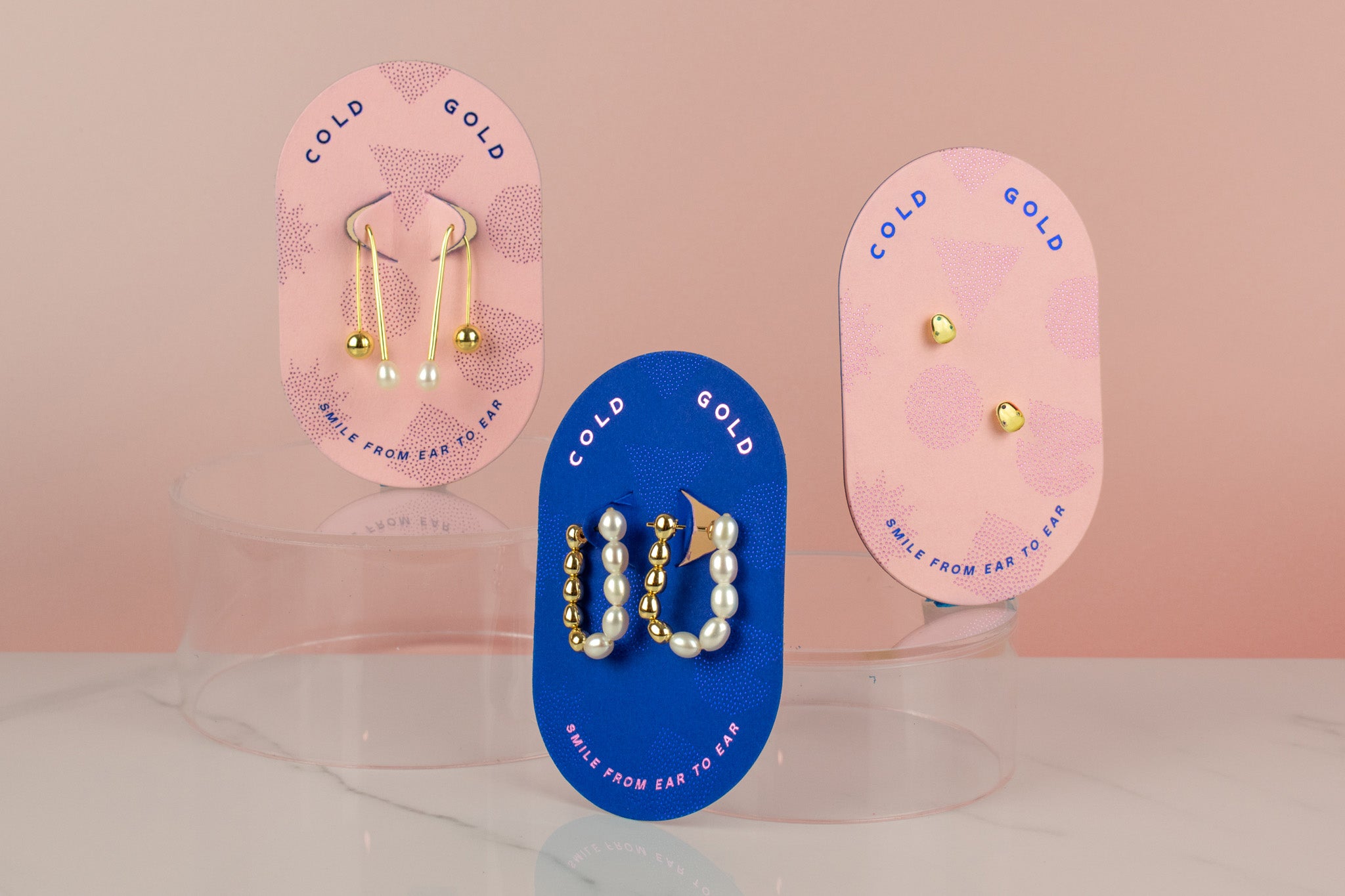 birth of venus collection photographed together pearl studs, pearl hoops, and pearl drop earrings