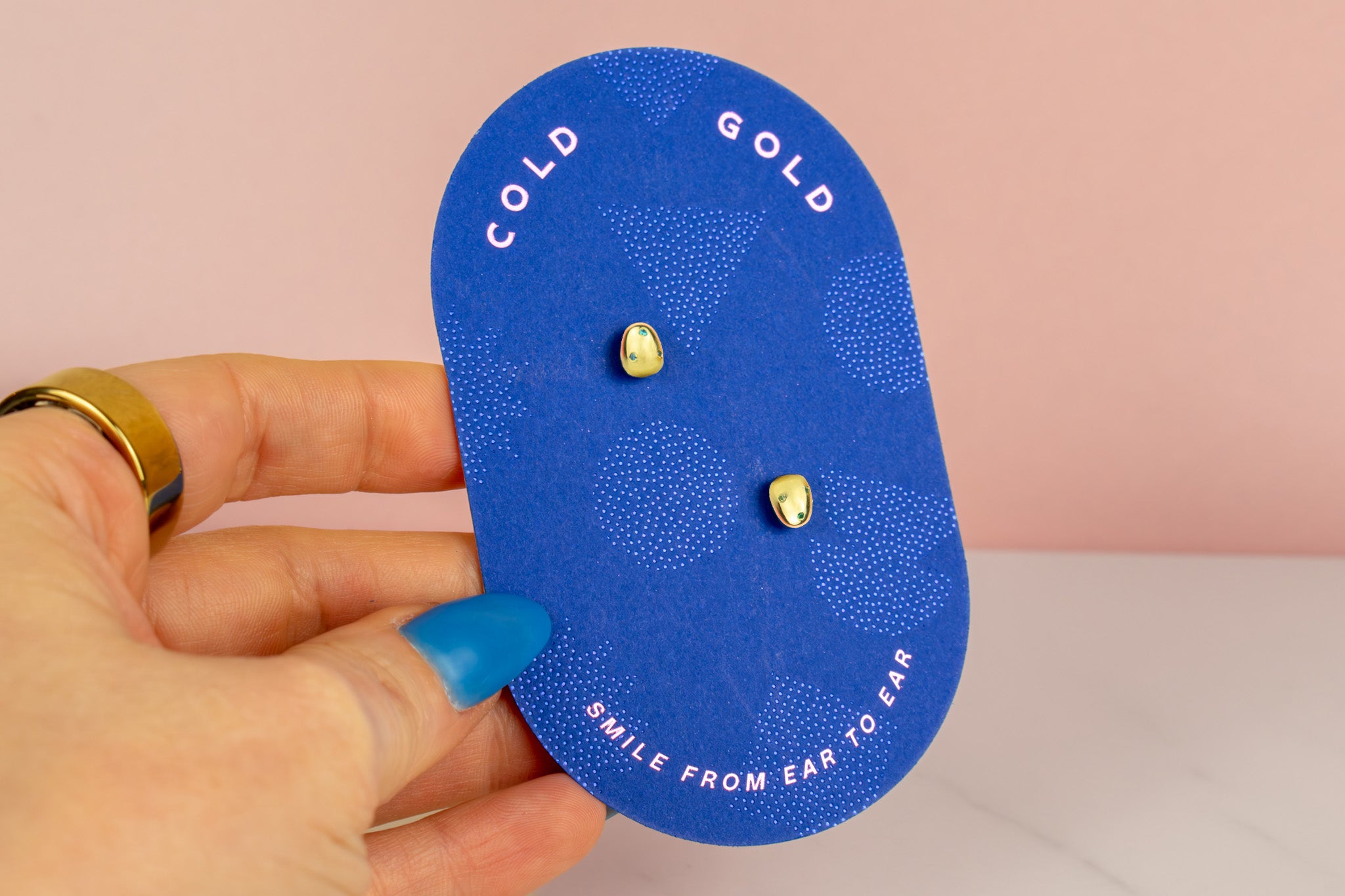 bright blue cold gold earring backer displaying 14k gold plated pearl studs with aquamarine sapphire emerald CZ gemstones