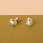 organic shaped freshwater pearl earrings encrusted with apple green, fuschia, rose quartz, emerald gemstones, sapphire gemstones