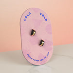 light pink geometric card holding black stud earring set geometric gold-plated stud earrings present jewelry