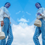 model posing with pebble grain drawstring bone white ivory cute mini bucket bag