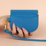 slim modern card holder in blue with exterior card pocket and central compartment