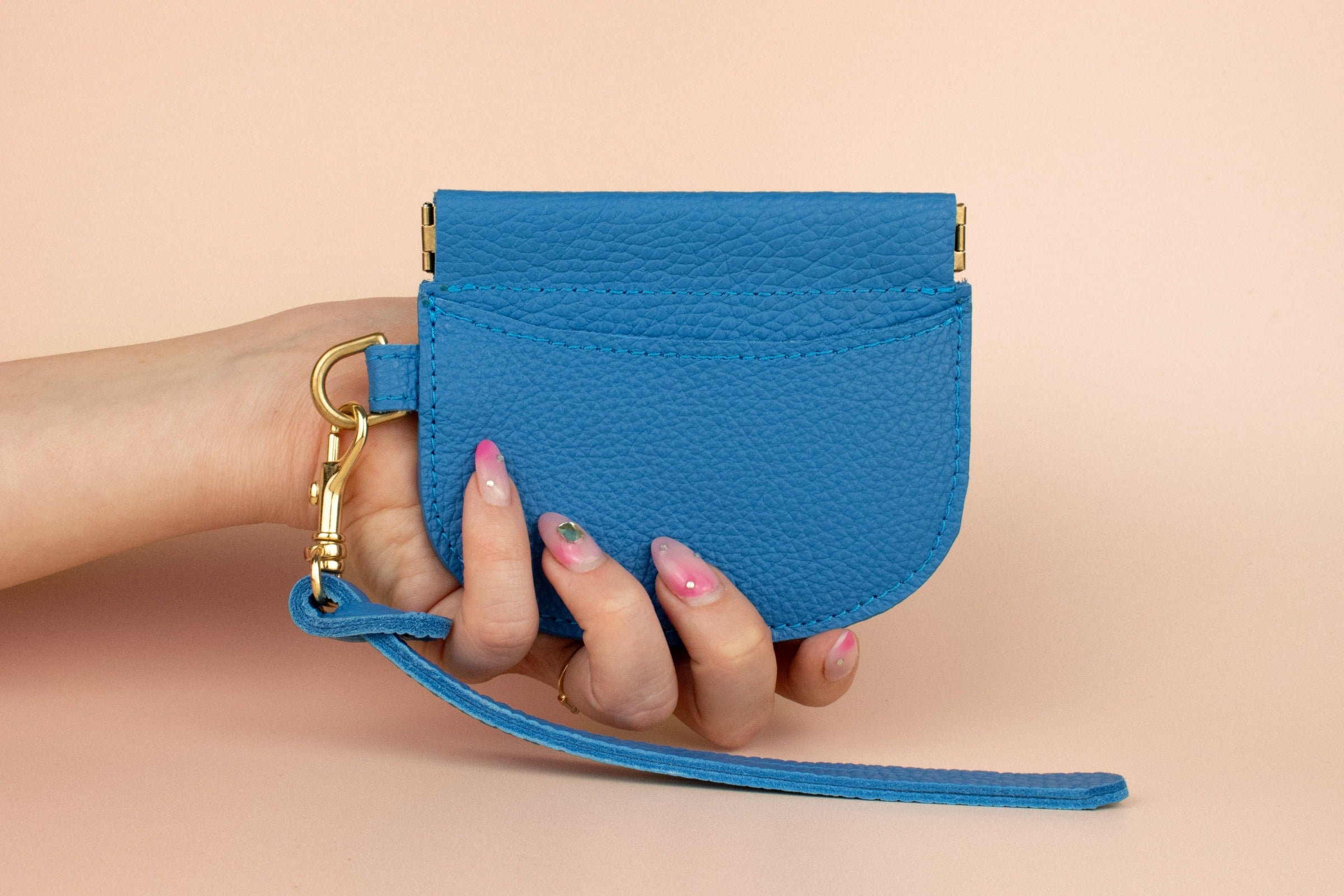 slim modern card holder in blue with exterior card pocket and central compartment