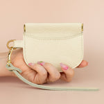 bone white small leather wristlet with gold hardware