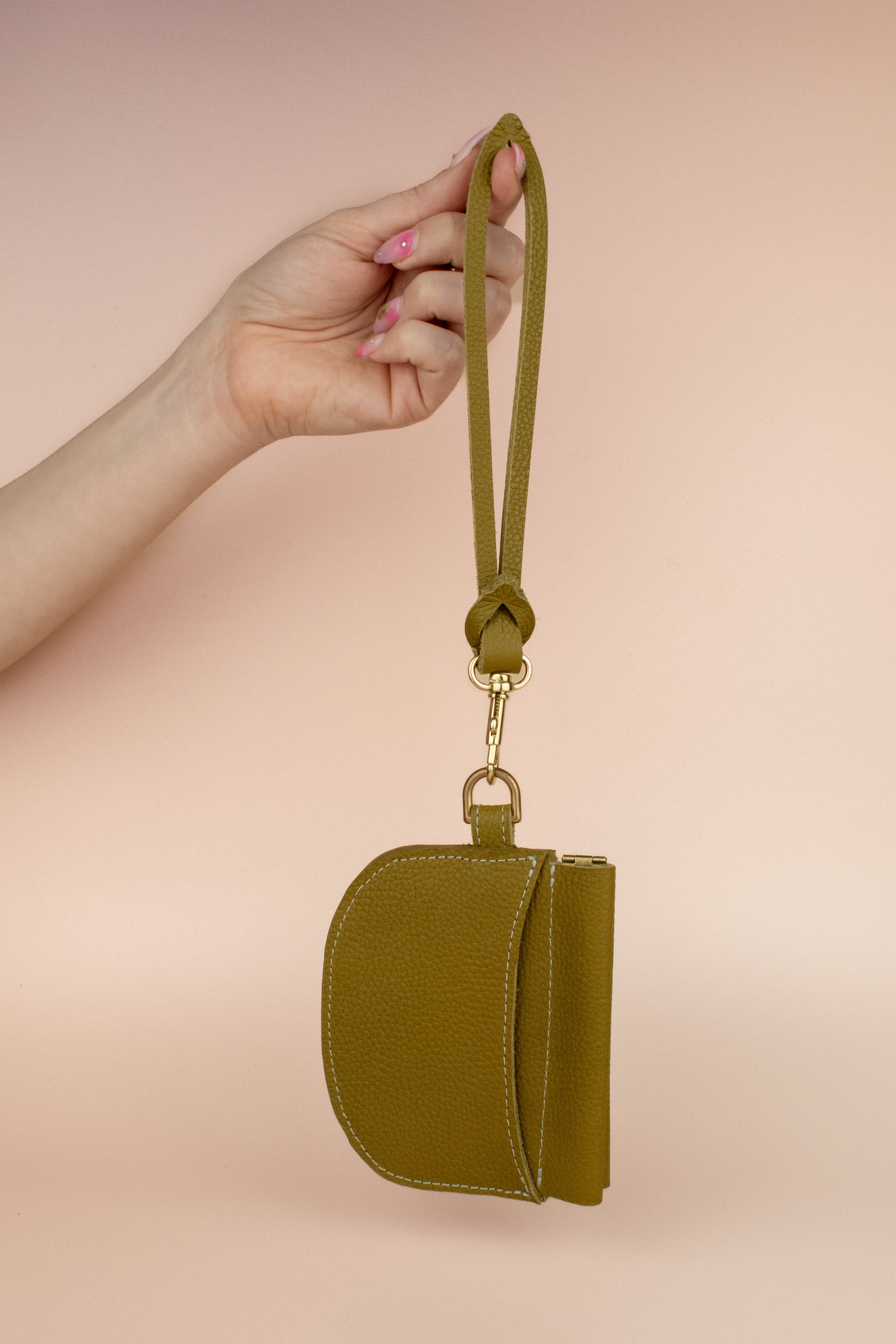 olive green leather wristlet wallet with exterior pocket and detachable modern strap keychain