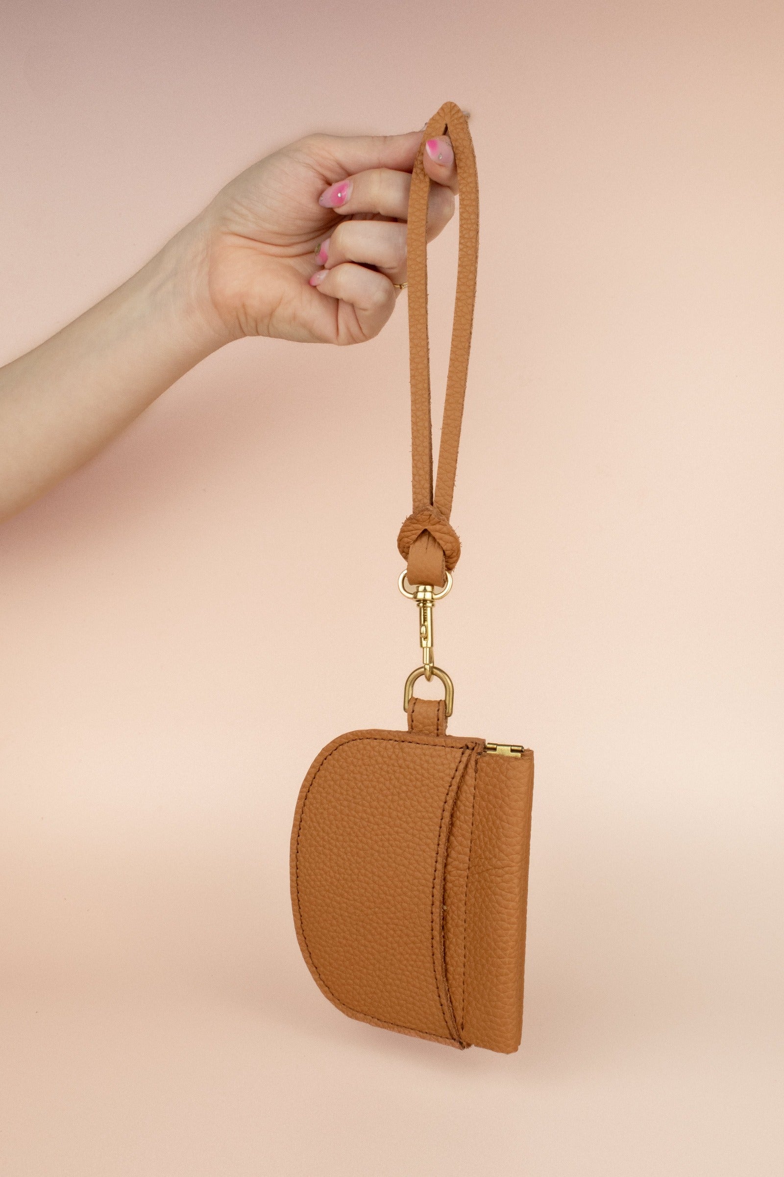 neutral pebble grain leather brown slim wristlet mini wallet with exterior pocket, gold hardware, and detachable wristlet