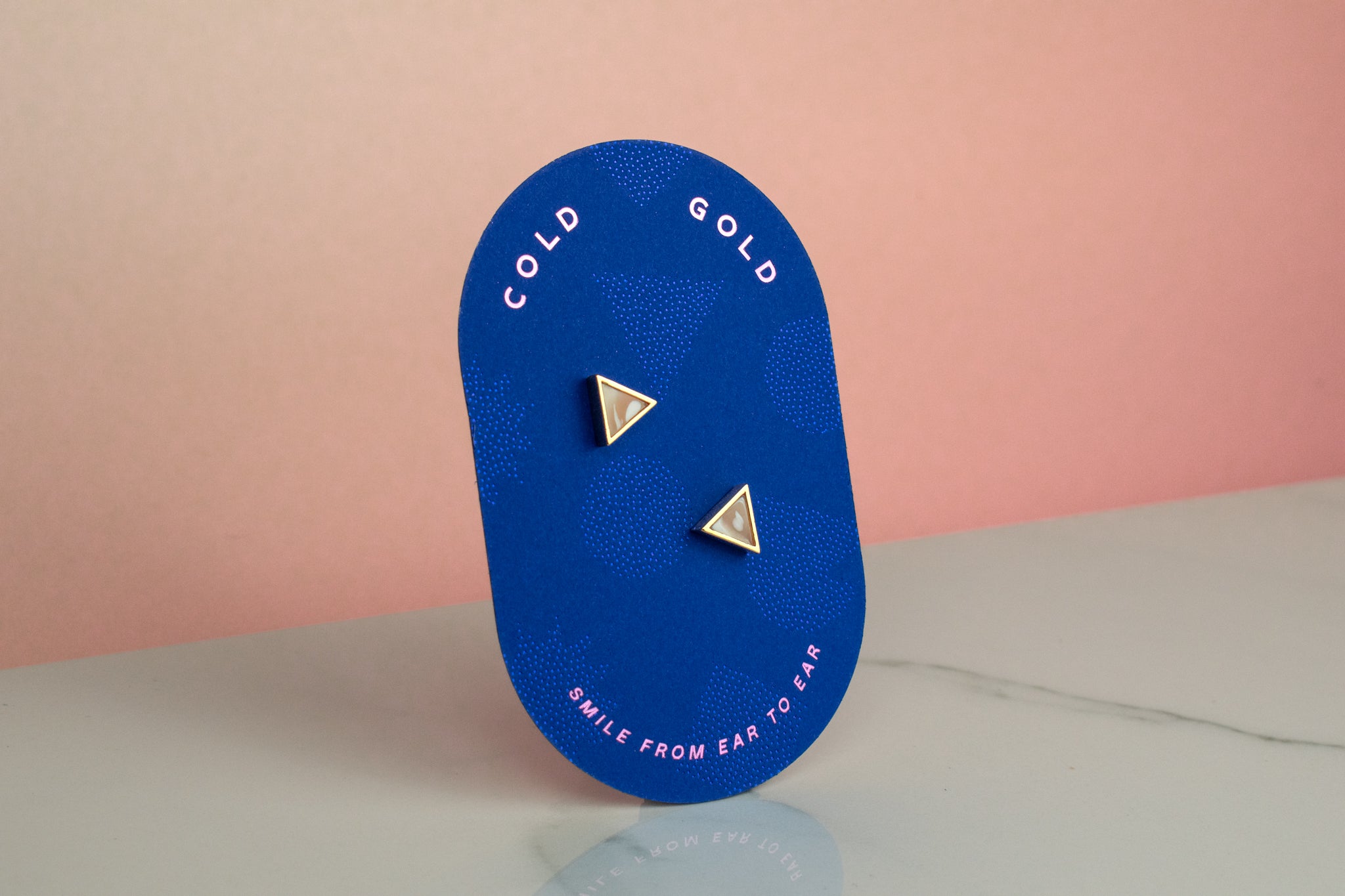 blue cold gold packaging showing marbled clear clay crystal quartz stud earrings birth stone gift gemstone earrings