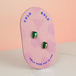 pink card displaying emerald gold hoop earrings may birthstone gift