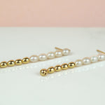 versatile dangly pearl and gold drop earrings