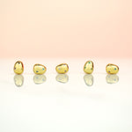 row of 14k gold plated baroque pearl earrings incrusted with tiny multicolored rainbow gemstones with sterling silver posts