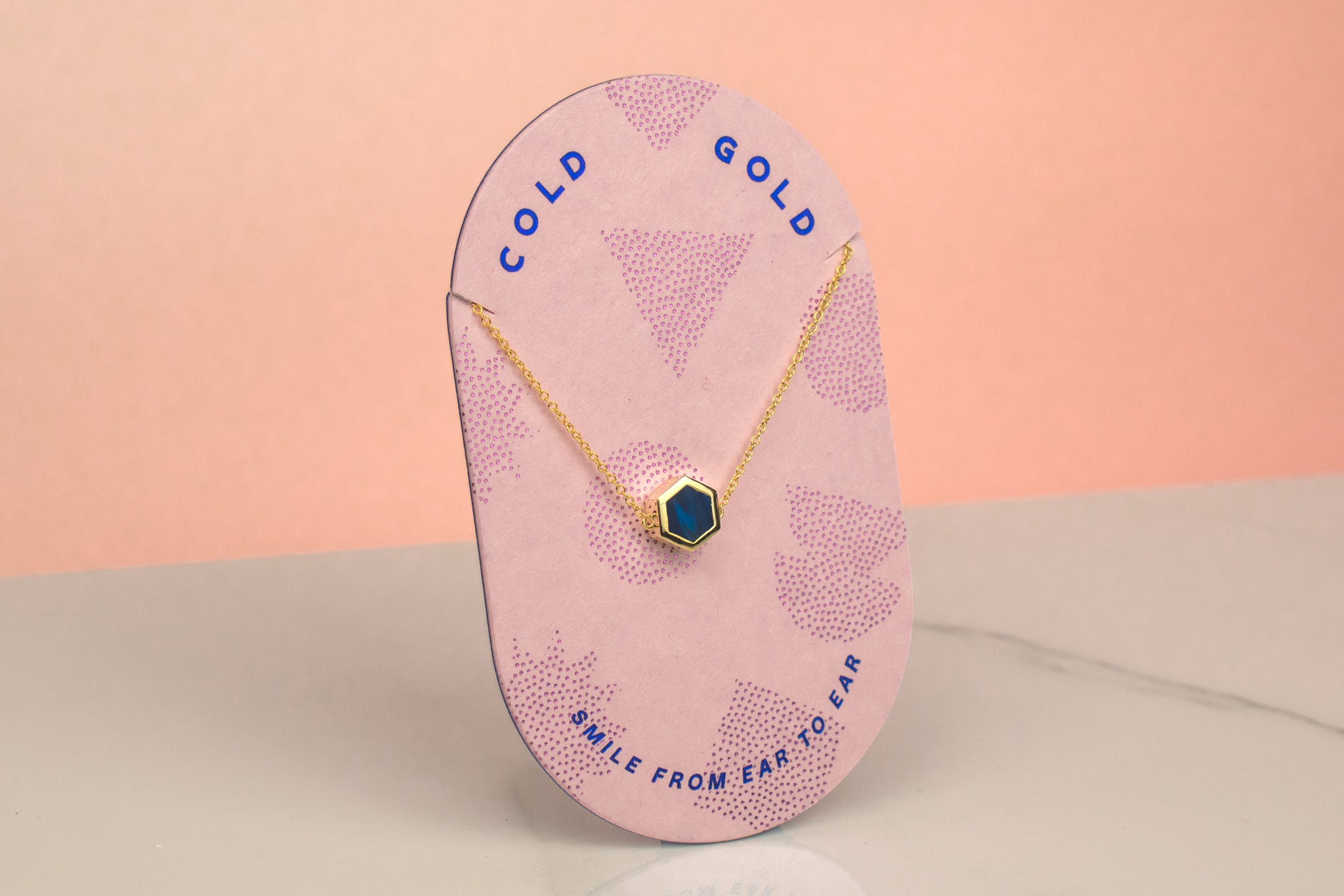 pink card displaying 14k gold plated blue gemstone inspired dainty necklace september birthstone gifts for her