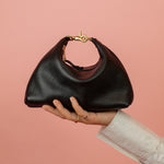 mini black leather crescent handbag with convertible design and gold hardware