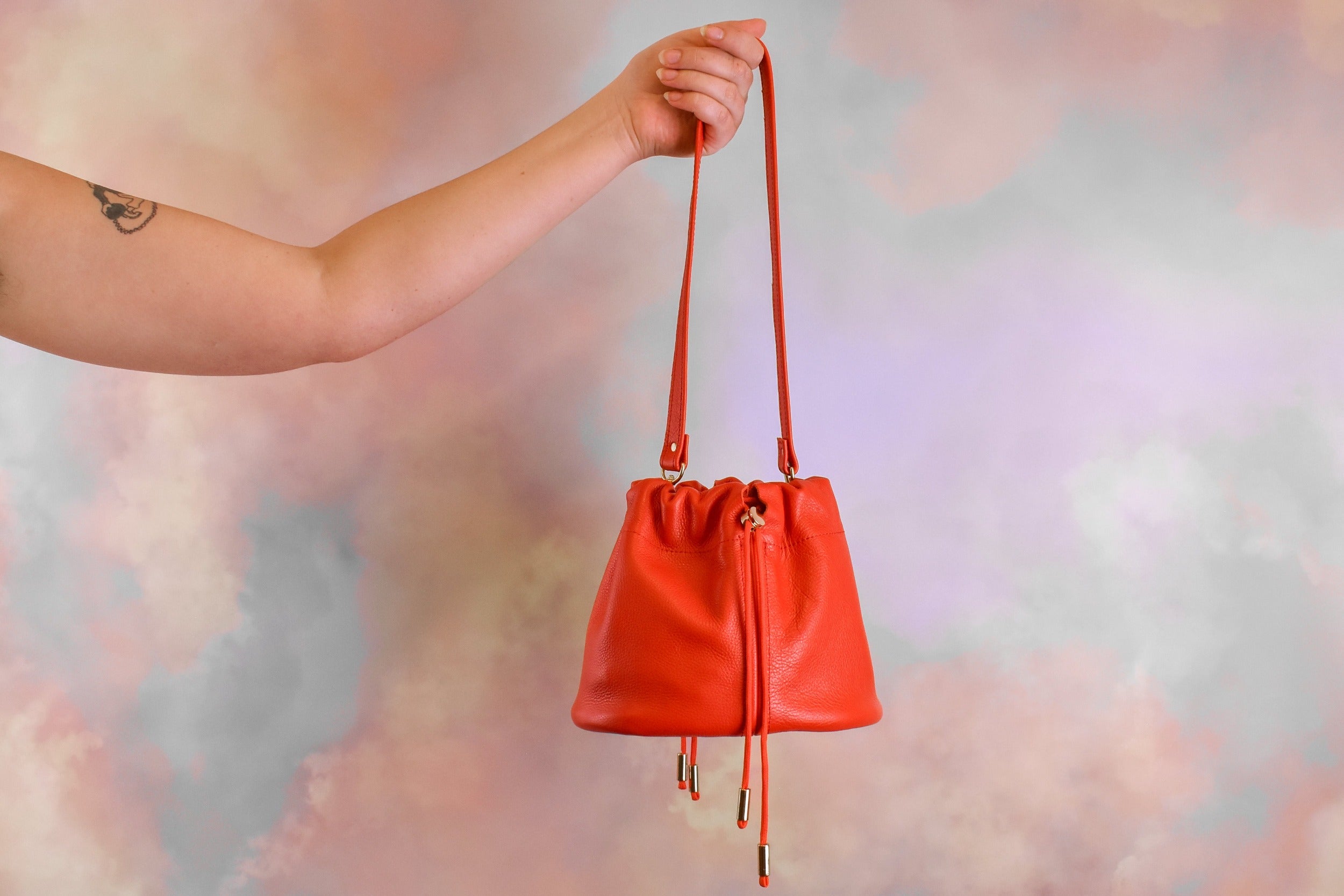 sporty chic cherry red medium sized everyday bucket shoulder bag