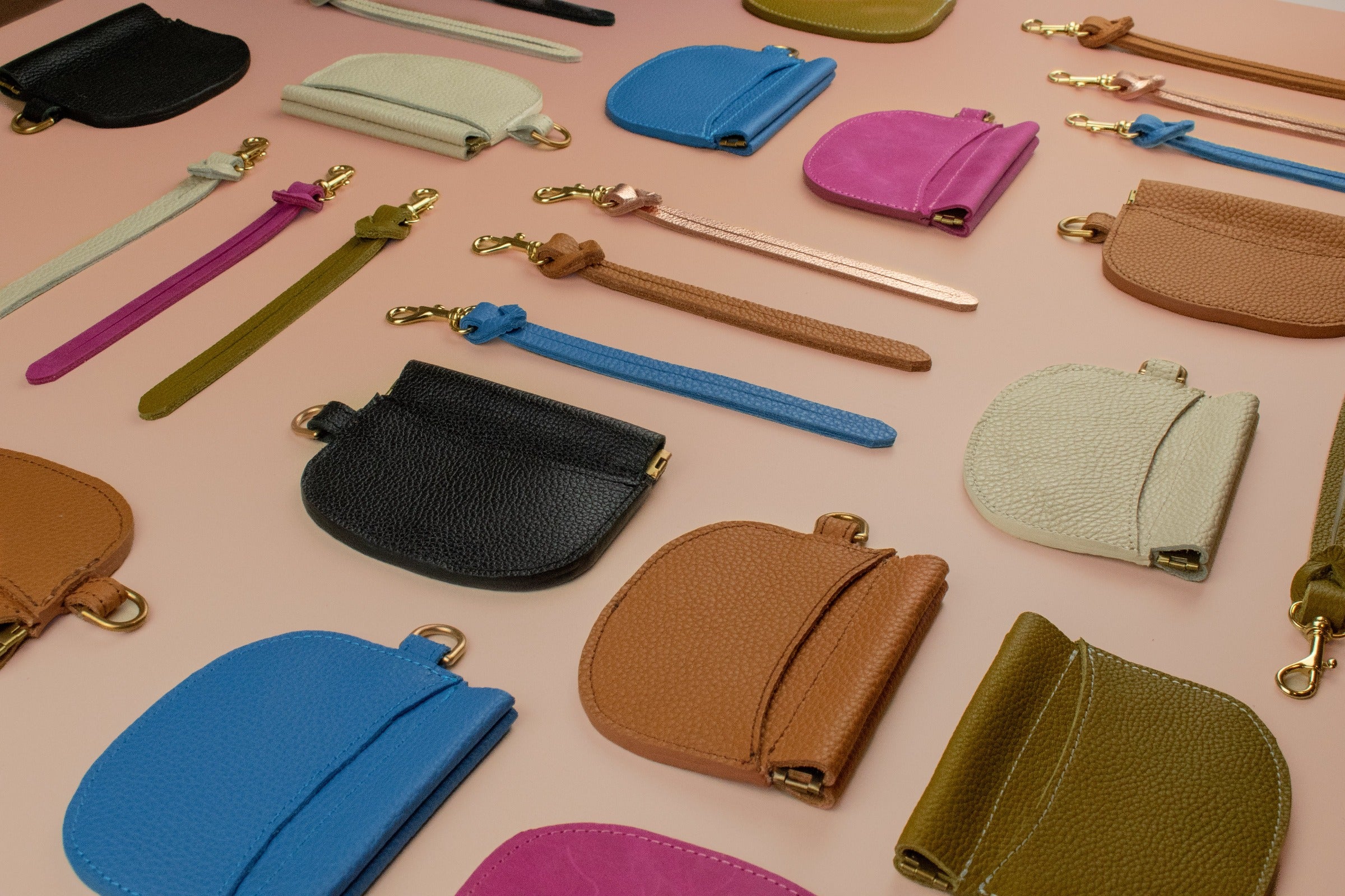 group shot of slim leather wallets with matching detachable wristlet keychains