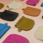 group shot of colorful handmade leather cardholders by cold gold