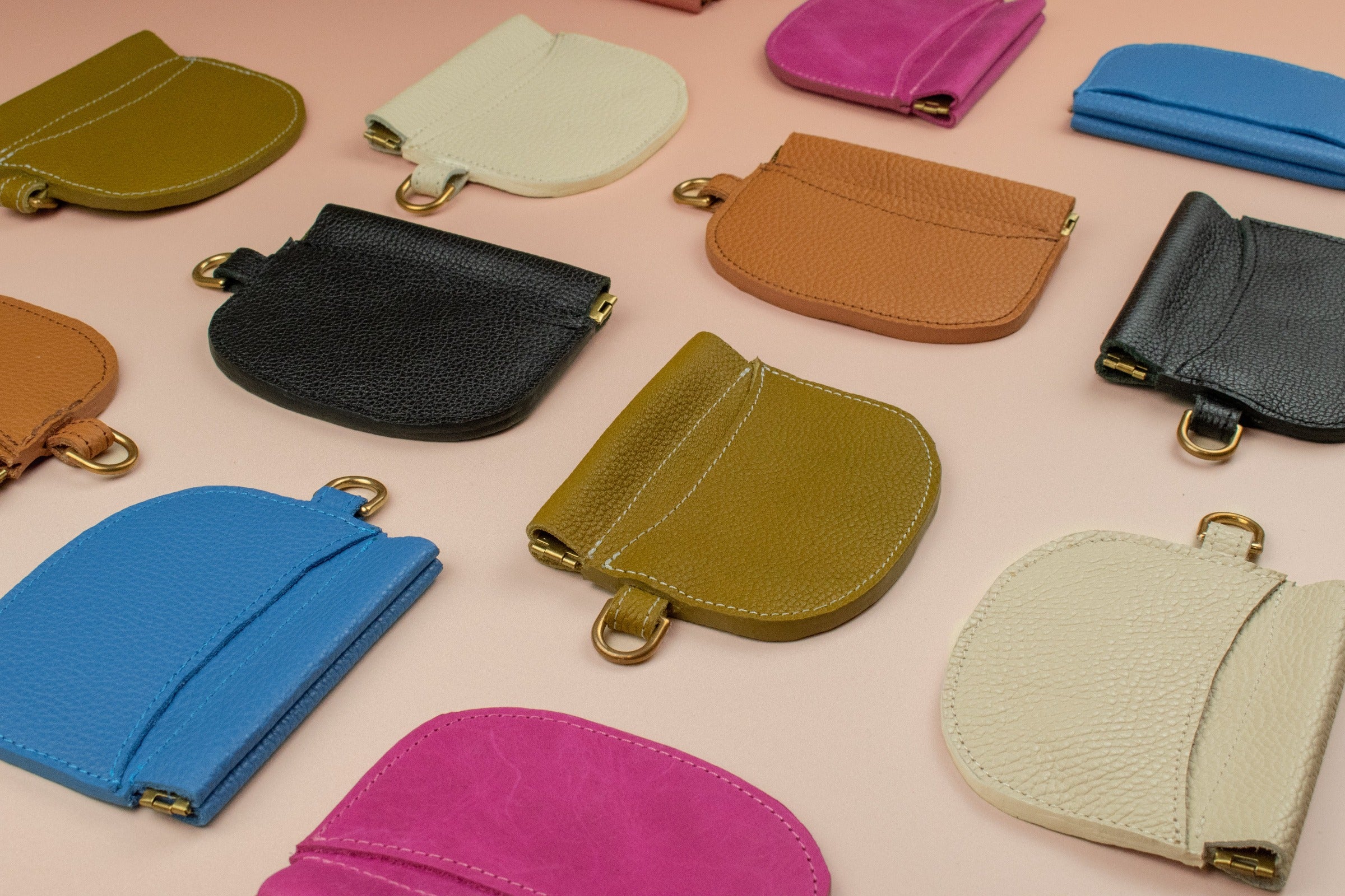 group shot of colorful handmade leather cardholders by cold gold