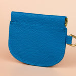back of bright blue compact mini leather wallet cardholder with squeeze open sides 