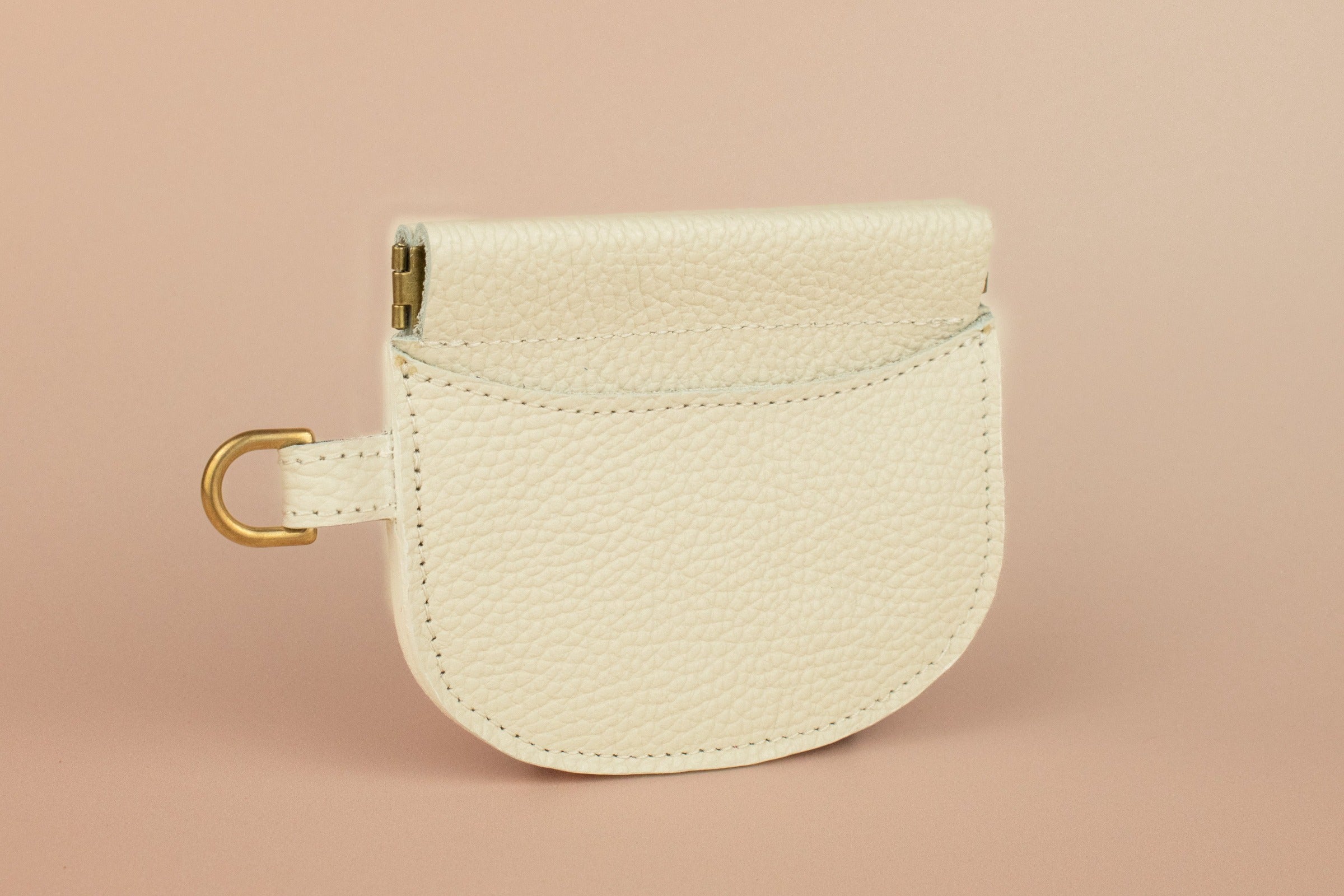 small minimal handmade leather wallet with gold hardware by cold gold, squeeze clasp wristlet wallet