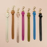 a series of colorful genuine handmade leather keychains