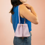 model carrying scrunchy top leather boho bucket bag in lilac