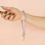 lilac loop wristlet leather keychain featuring knot and gold hardware clasp