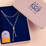 modern formal bolo tie in sterling silver with adjustable sliding pendant photographed inside cold gold jewelry box