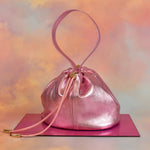 metallic pink leather mini bucket bag drawstring closure unstructured silhouette