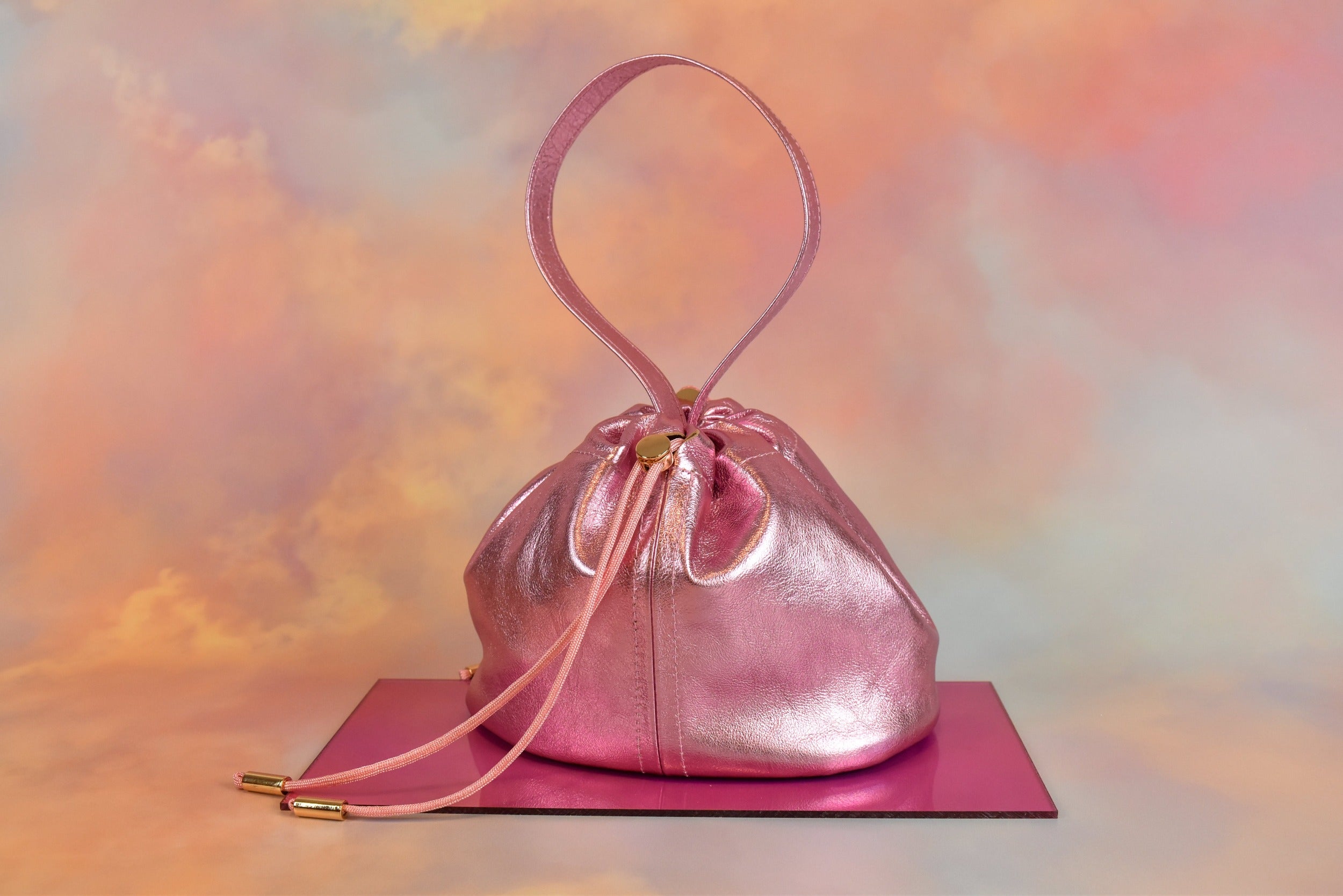 metallic pink leather mini bucket bag drawstring closure unstructured silhouette