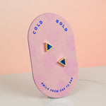 pink card displaying pair of geometric handmade sapphire polymer clay earrings 14k gold plated