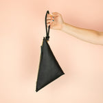 loop keychain attached to black leather crossbody bag