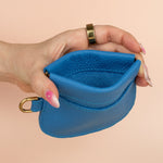 squeeze closure blue leather mini pouch wallet with exterior card pocket safe for travel