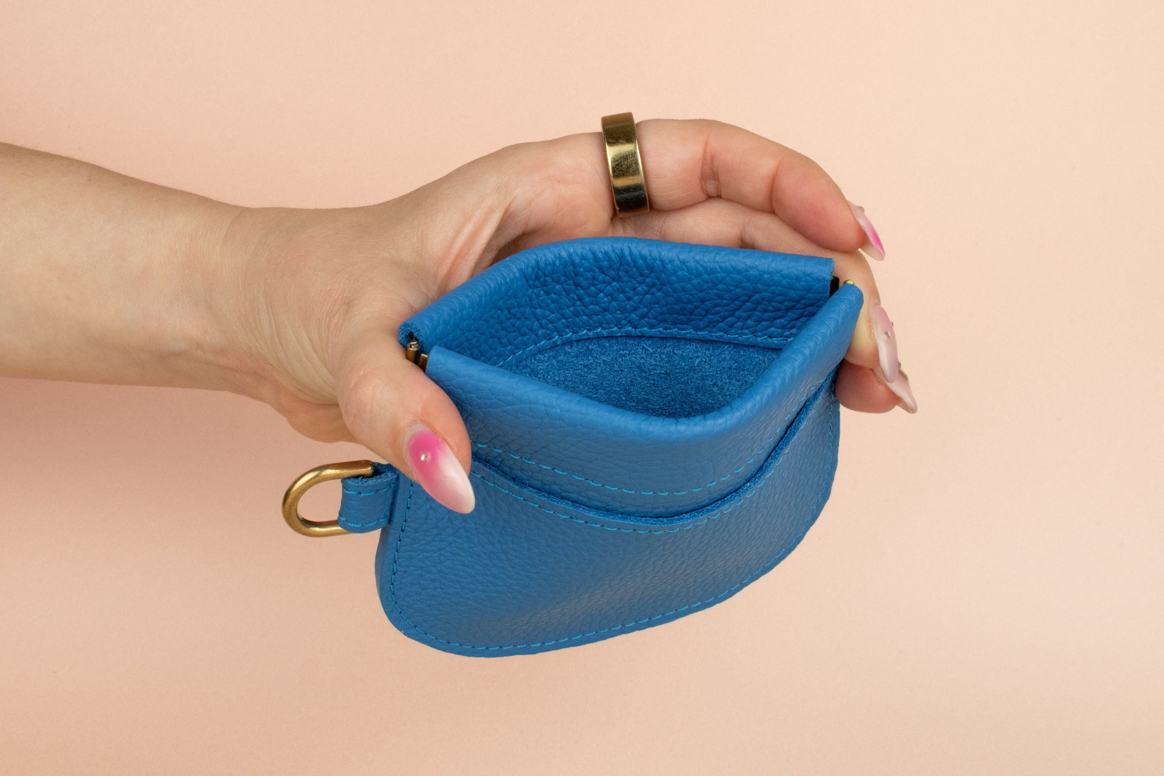 squeeze closure blue leather mini pouch wallet with exterior card pocket safe for travel