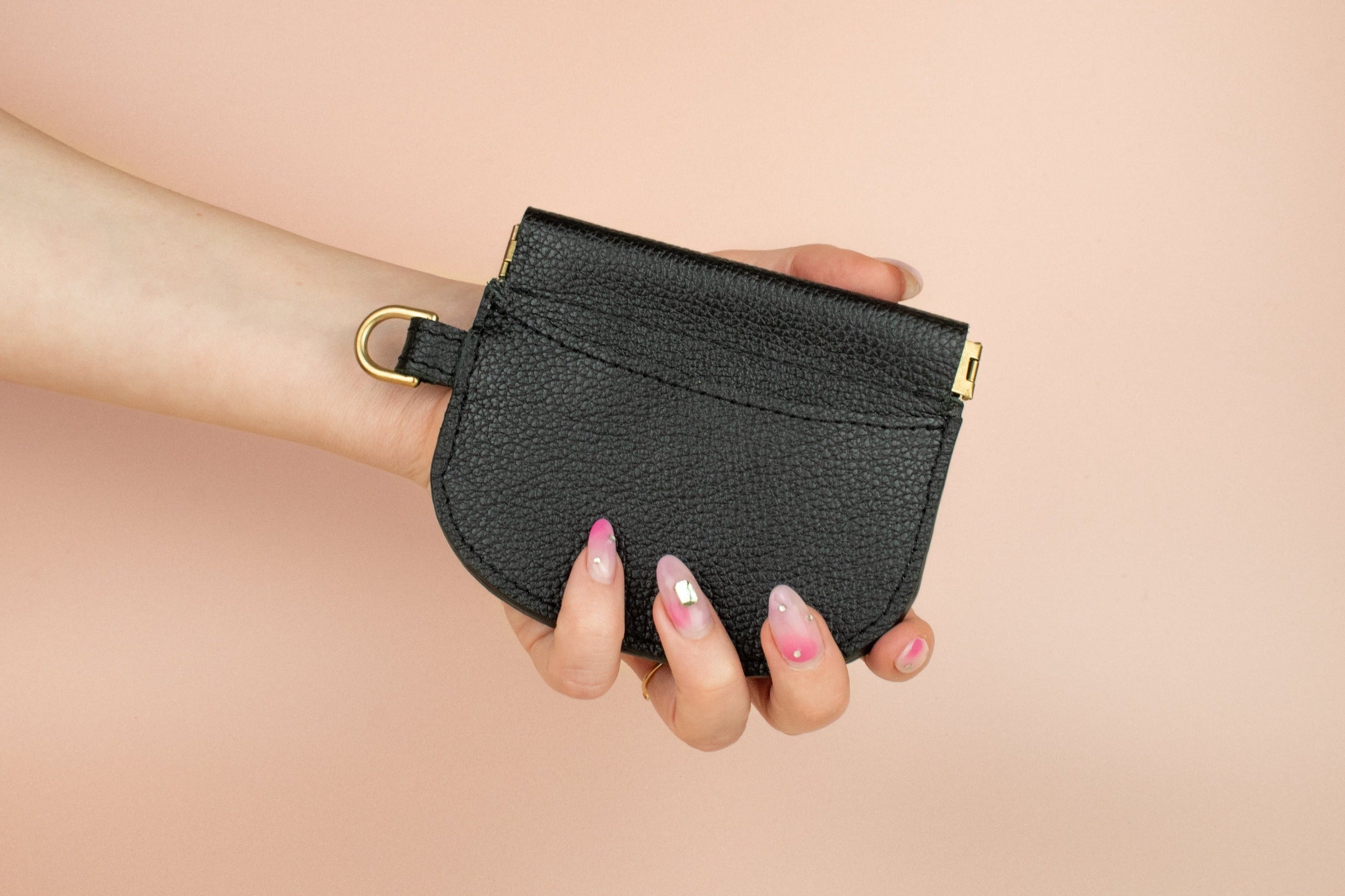 modern slim black leather cardholder with exterior pocket and central compartment