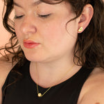 model wearing 14 gold plated matching rainbow terrazzo hexagon necklace and half moon earrings