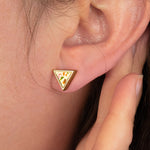 detail shot of unique gold stud earrings in white terrazzo with multicolored angular chips of clay