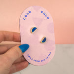 geometric half moon handmade stud earrings in blue sapphire gemstone blue clay on pink card