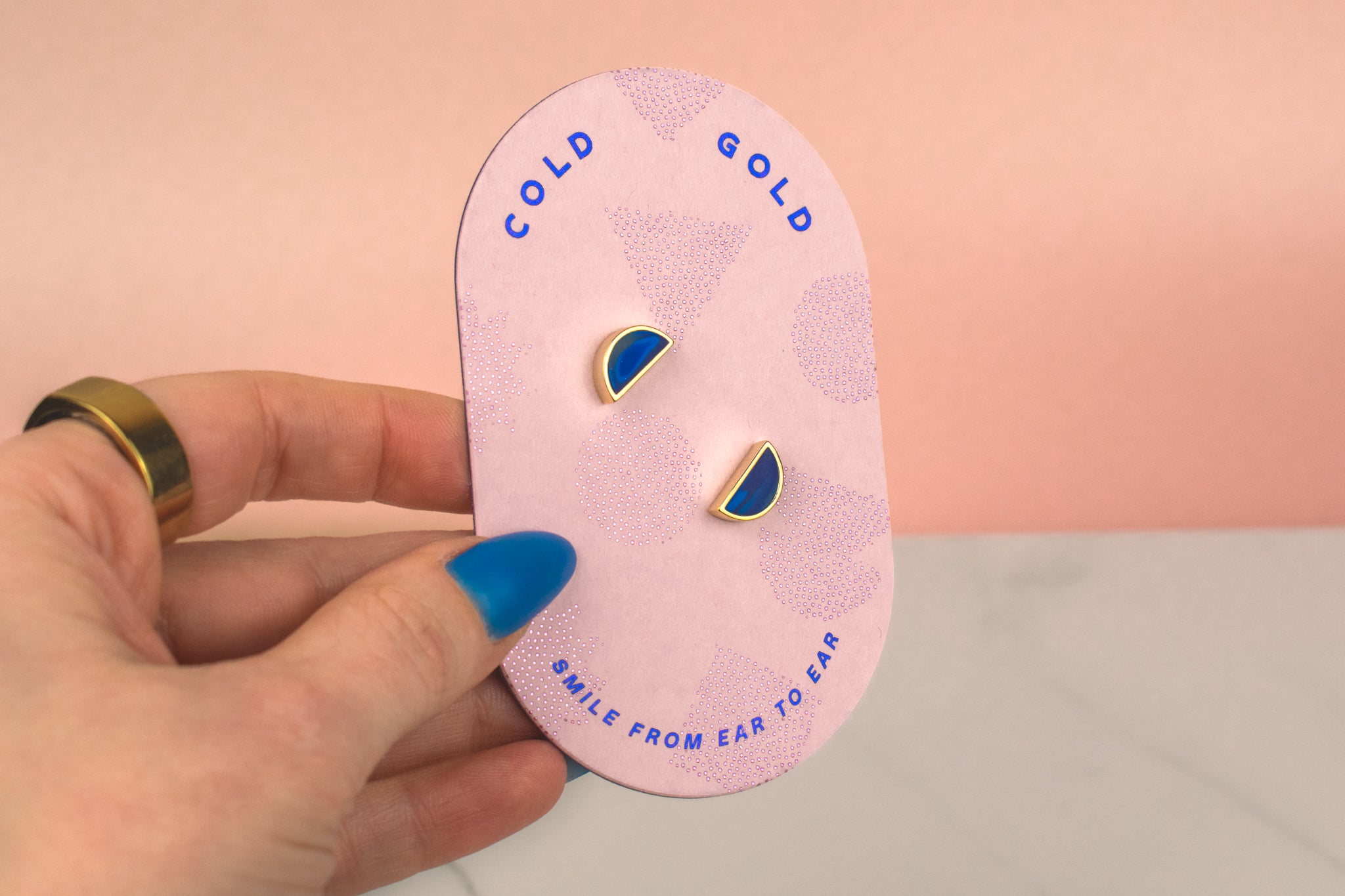geometric half moon handmade stud earrings in blue sapphire gemstone blue clay on pink card