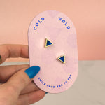 hand holding pink card displaying pair of blue sapphire gemstone inspired earrings sterling silver posts september birthstone gift