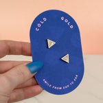 hand holding white quartz handmade 14k gold plated  triangle geometric stud earring set birthday gift gemstone earrings on blue card