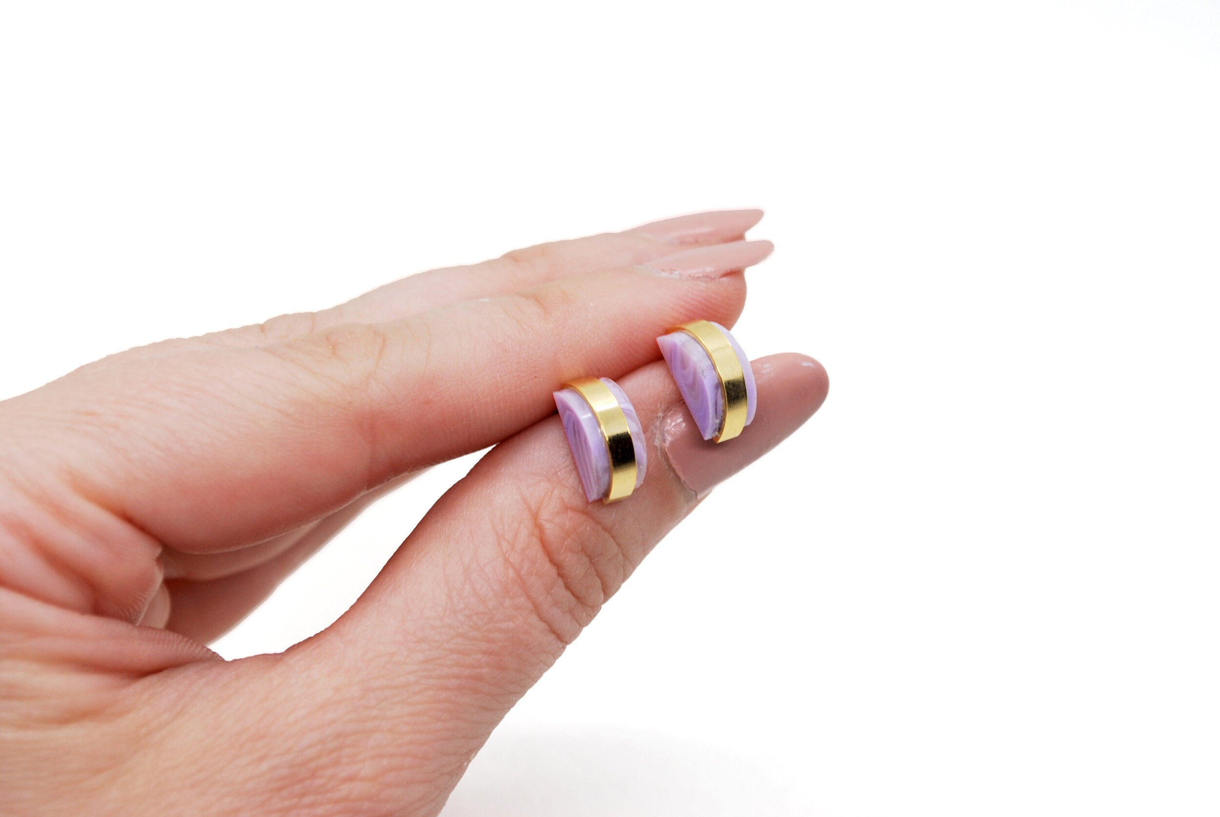 geometric polished brass marbled stud set.