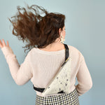 a woman shows off a cowprint bag leather purse for music festival essentials bag small leather sling bag crossbody cowhide leather cowprint gift for bridesmaids sling bag with inner pocket