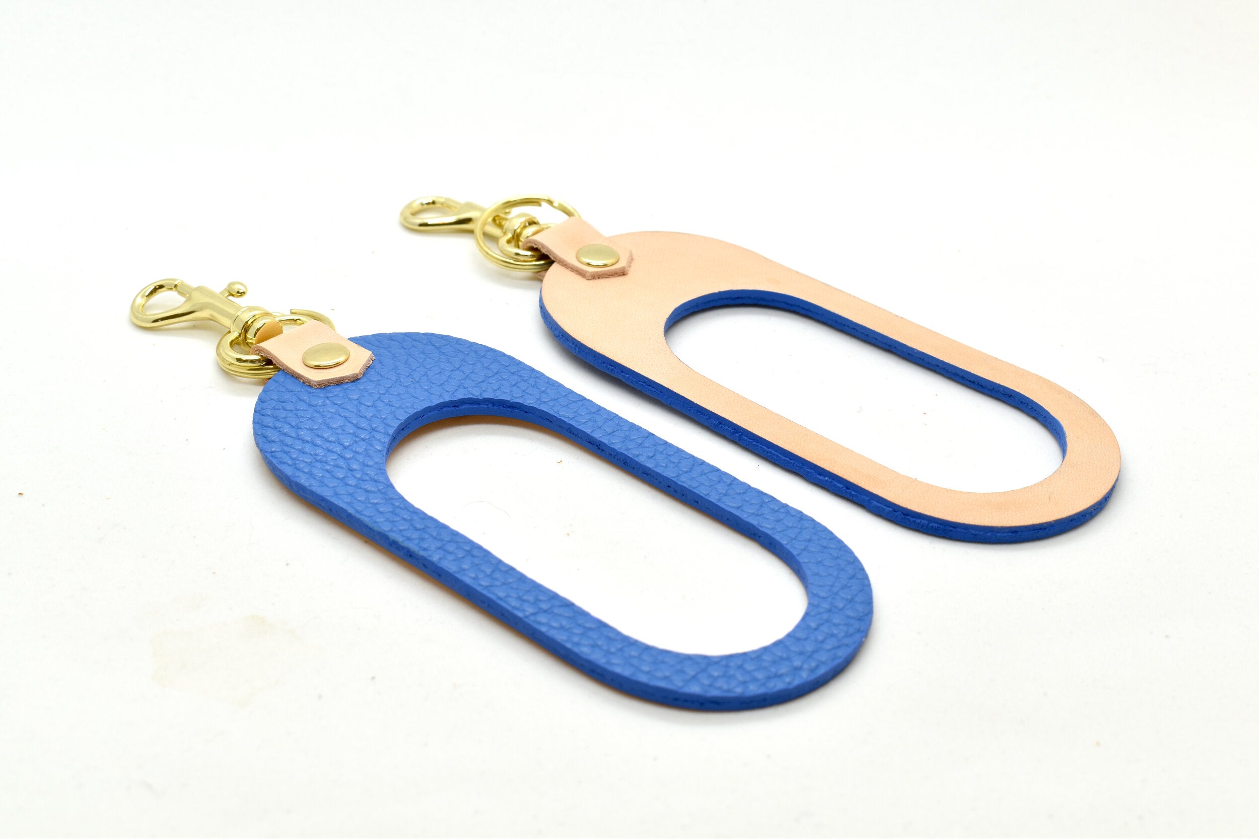 minimalist and modern leather keychain designed with comfortable hand cut out in matisse blue