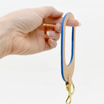 oval shaped leather keychain in royal blue leather and rawhide veg tan leather