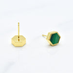 gold hexagon studs with back of stud and sterling silver posts that are hypoallergenic shown against a white background, includes 14k gold plated earrings with emerald gem clay