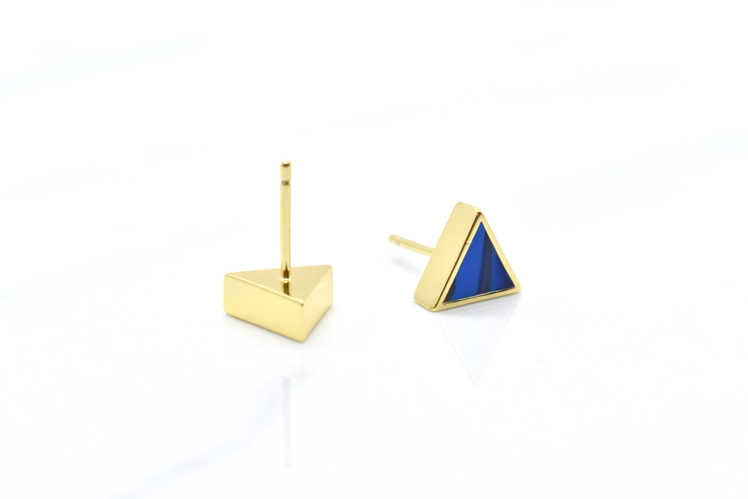 geometric triangle stud earrings in deep cobalt blue showing the backside where you can see the 14k gold plated posts that are hypoallergenic and good for sensitive ears