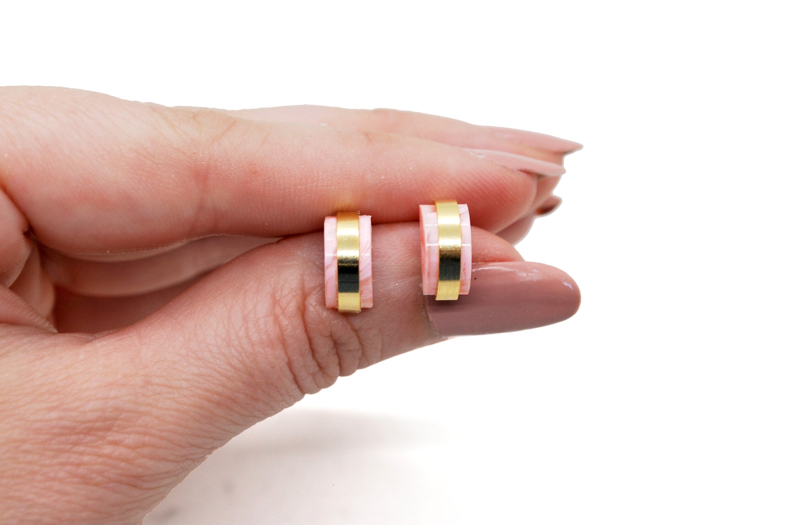 marbled translucent pink geometric shape studs.