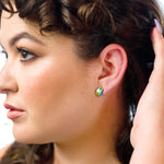 model wearing aquamarine studio stud gold geometric earring gold studs architectural jewelry simple studs