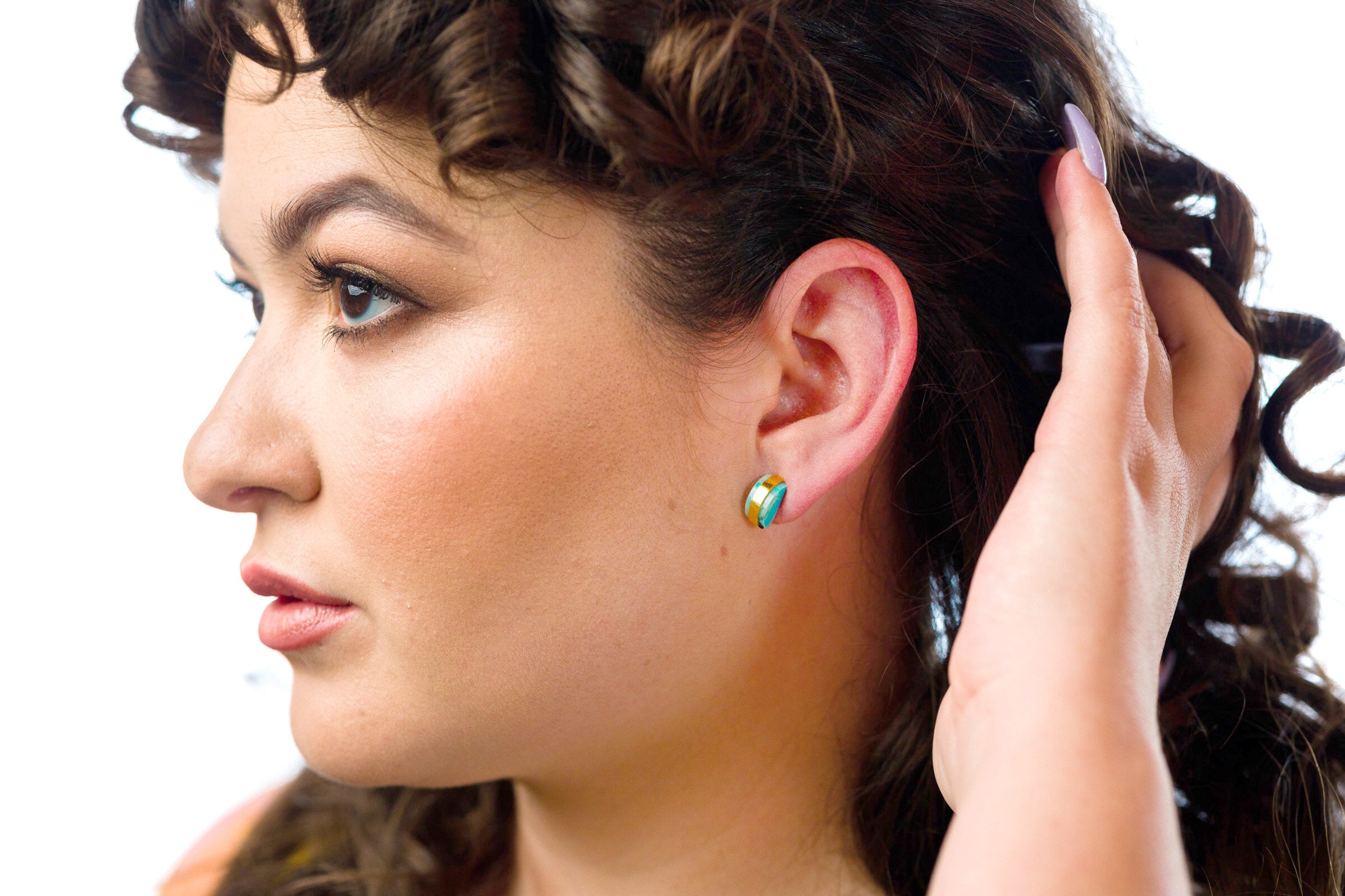 model wearing aquamarine studio stud gold geometric earring gold studs architectural jewelry simple studs